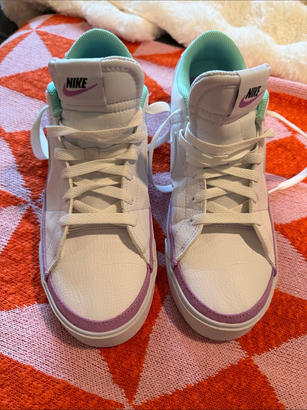 Nike Woman’s White Sneakers with Purple and Mint Accents